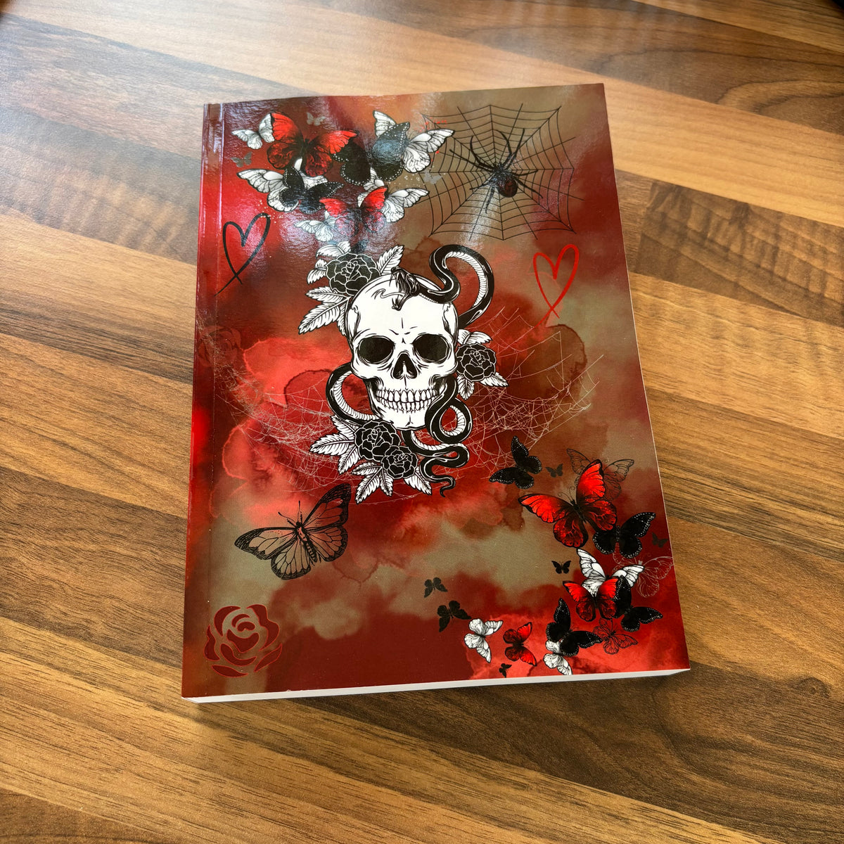 Dark romance book journal with gothic cover featuring skull, butterflies and smoke effect
