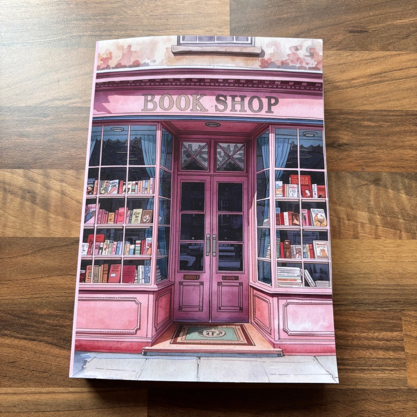Bookshop-themed book journal on a wooden surface