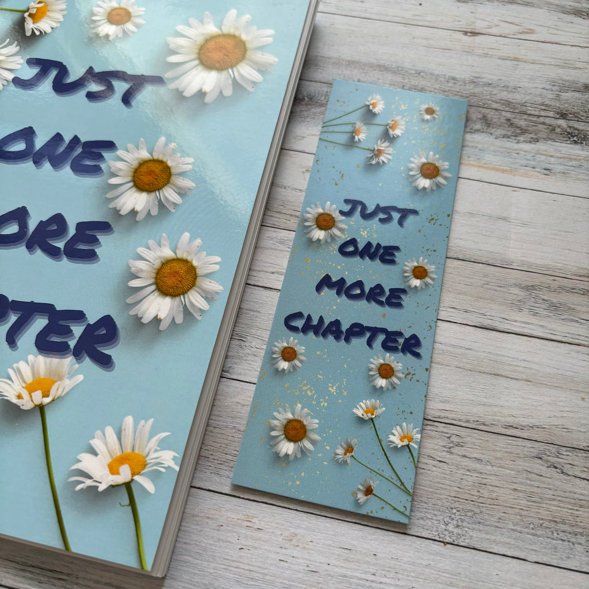 Light blue bookmark with daisies