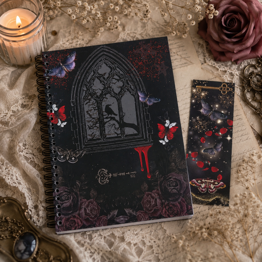 A gothic-themed notebook and matching bookmark set displayed on a vintage-style printed sheet with lace, a lit candle, and dried flowers. The notebook cover features a black arched window with a bird silhouette, blue butterflies, red roses, and a red blood-drip motif, while the bookmark complements the design with stars, butterflies, and red petals.