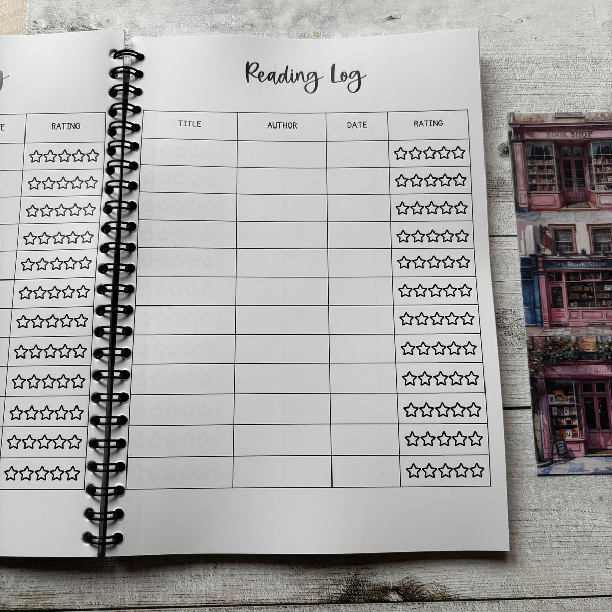 Reading log sheet in a notebook with a photo of a bookshelf in the background