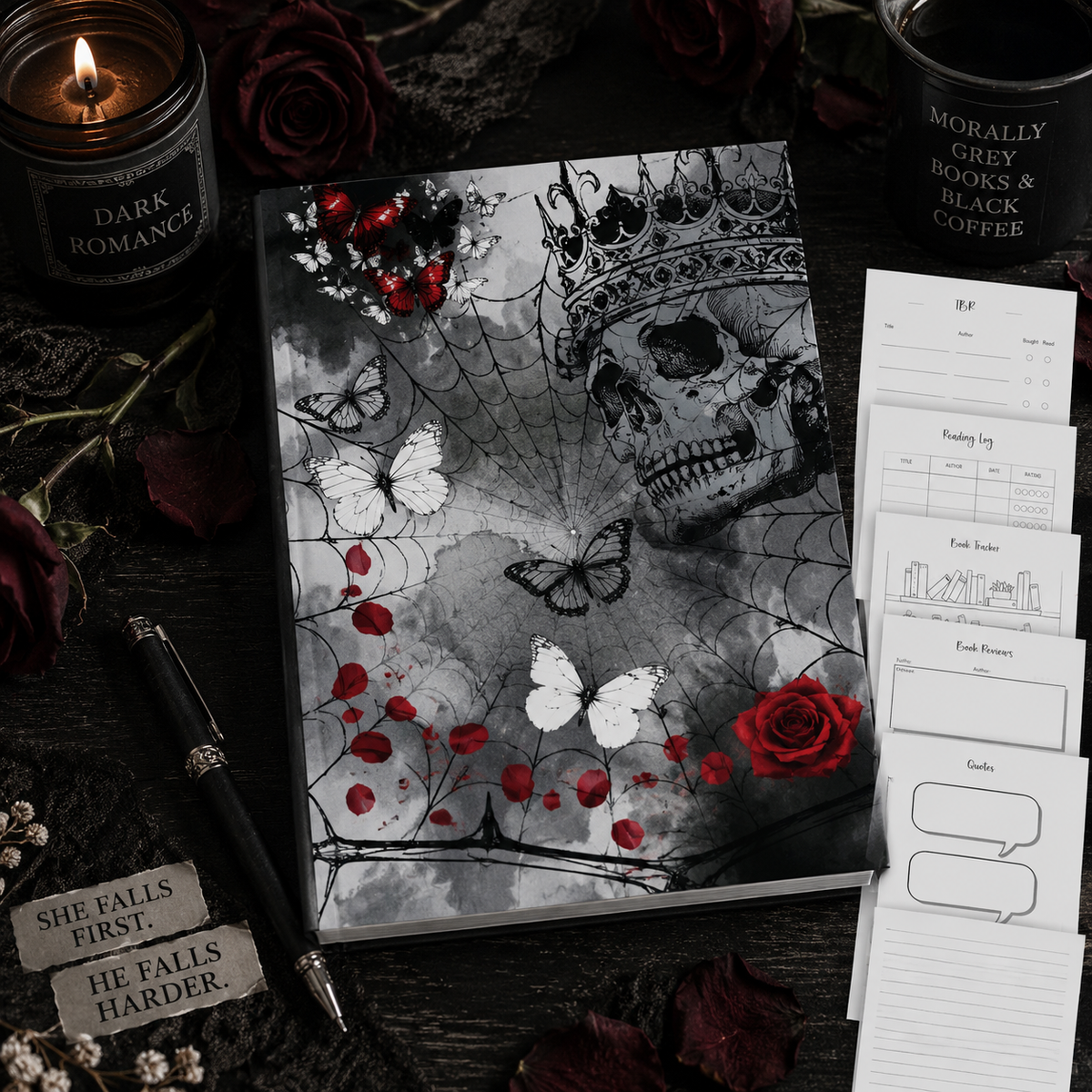 A dark romance journal displayed on a dark wooden surface, featuring a notebook with a black and white skull and crown design accented by red roses, a calendar page, a habit tracker, and labels. The scene is styled with a candle, a pen, and rose petals.