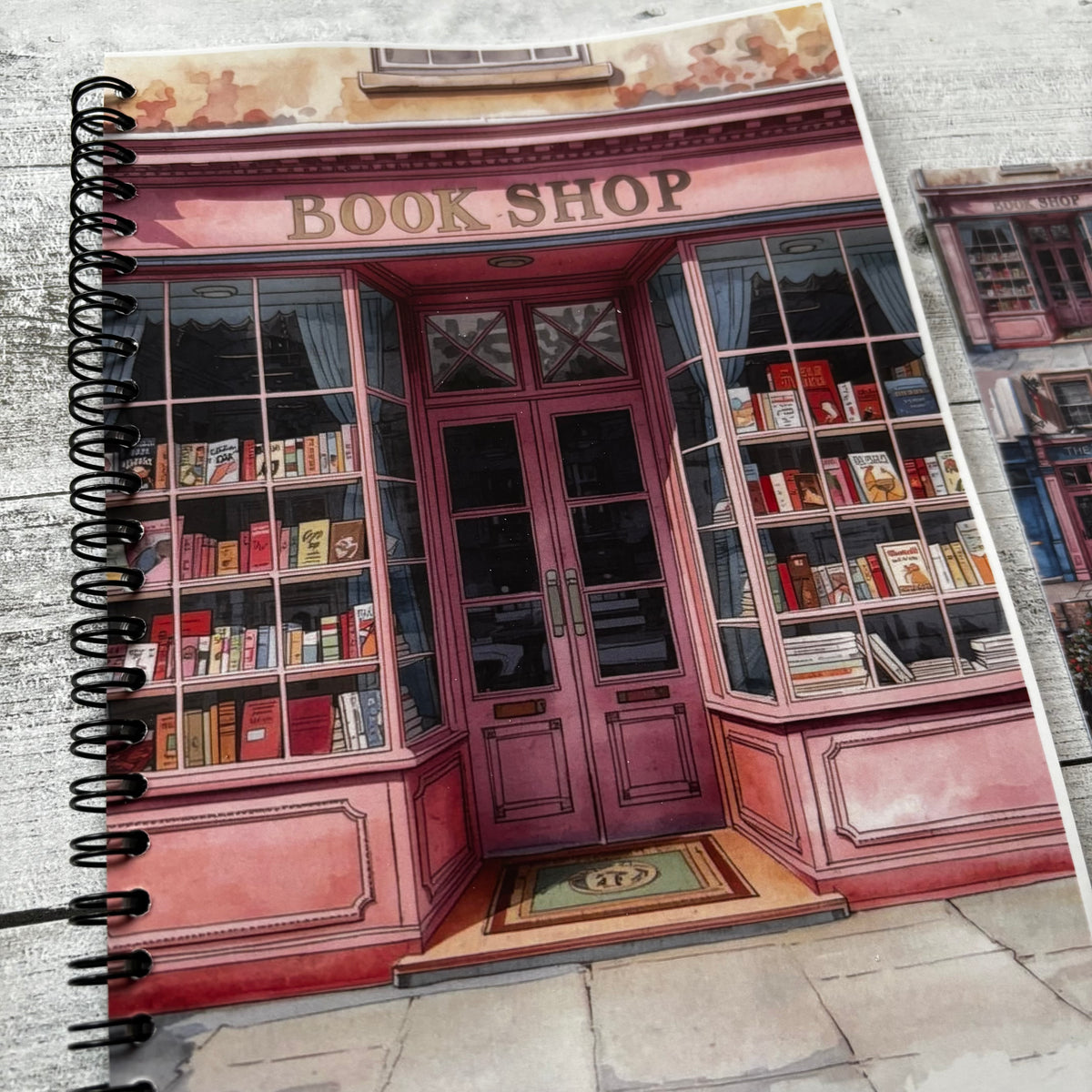 Journal with a cover design of a pink bookshop.