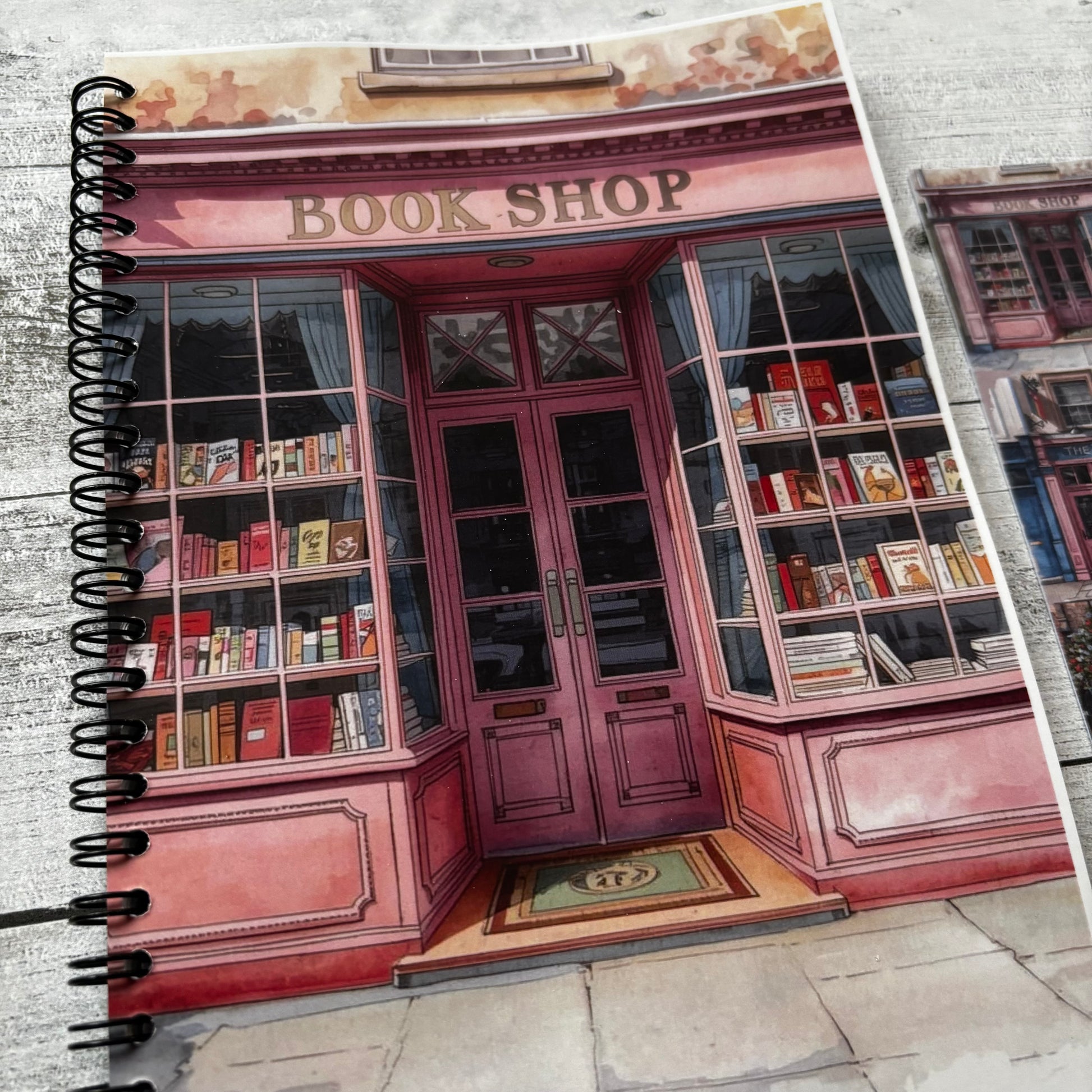 Journal with a cover design of a pink bookshop.